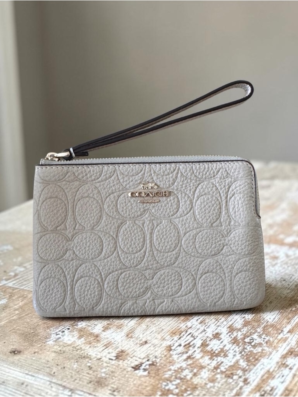 Coach Embossed Pebbled Leather Wristlet in Light Tan with Gold Logo